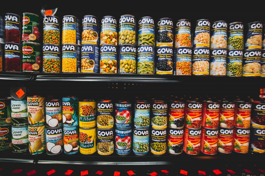 Lots of canned Goya beans on two shelves