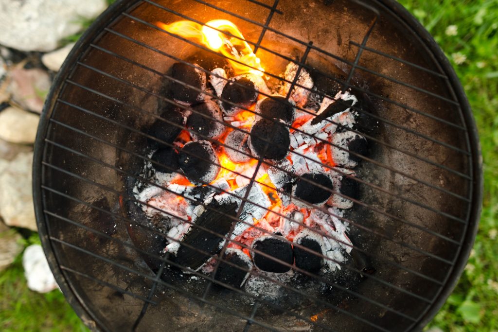 Charcoal ashes hot in small grill